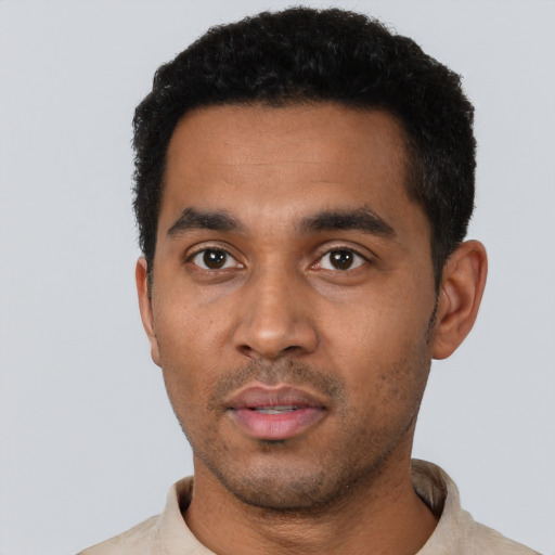 Neutral black young-adult male with short  black hair and brown eyes