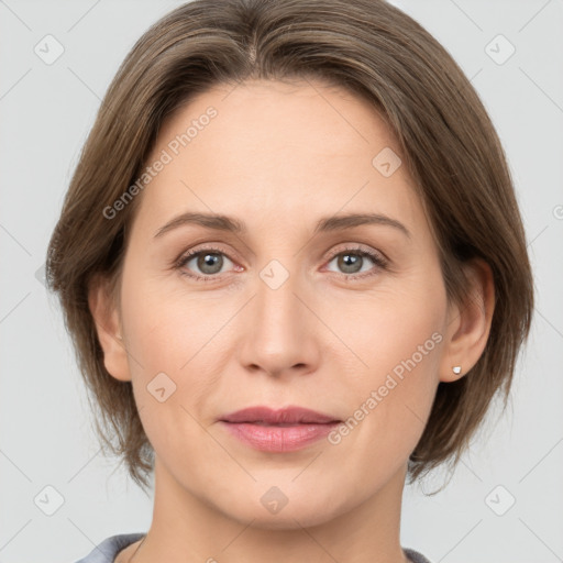 Joyful white adult female with medium  brown hair and grey eyes