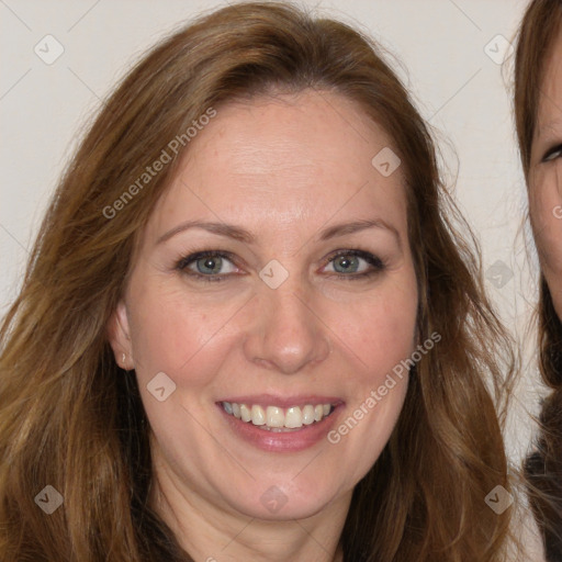 Joyful white adult female with long  brown hair and brown eyes