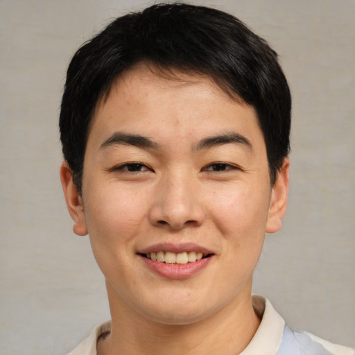 Joyful asian young-adult male with short  brown hair and brown eyes