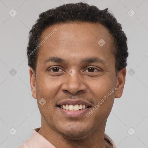 Joyful latino young-adult male with short  brown hair and brown eyes