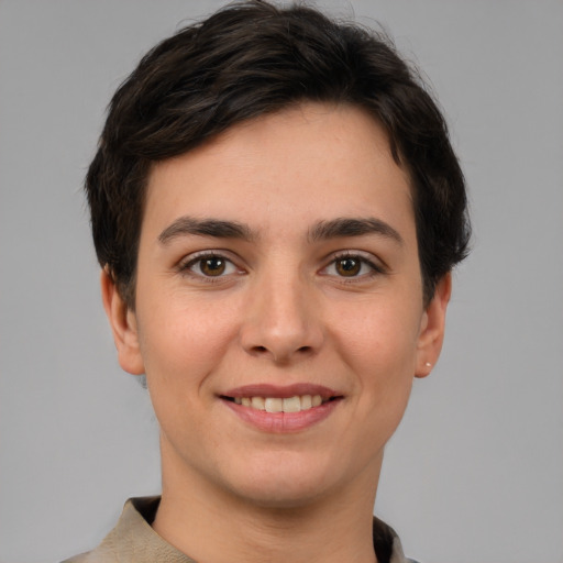 Joyful white young-adult female with short  brown hair and brown eyes