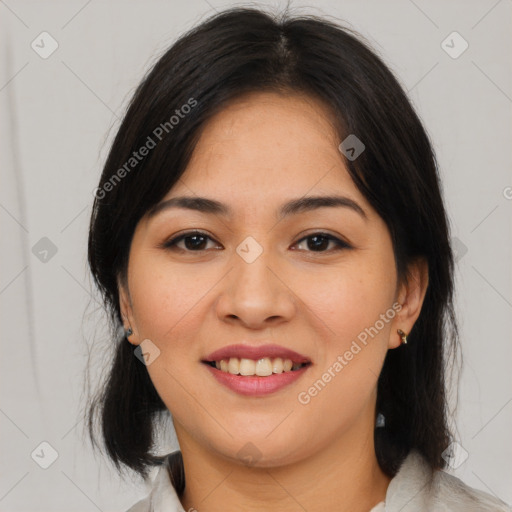 Joyful latino young-adult female with medium  brown hair and brown eyes