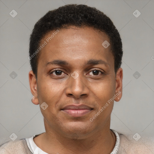 Joyful latino young-adult male with short  brown hair and brown eyes