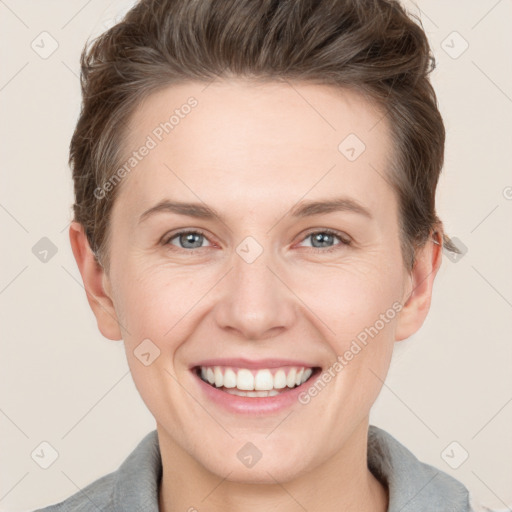 Joyful white young-adult female with short  brown hair and grey eyes