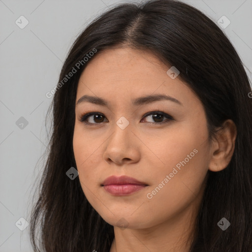 Joyful asian young-adult female with long  brown hair and brown eyes