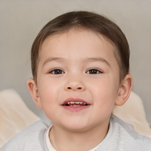 Joyful white child male with short  brown hair and brown eyes