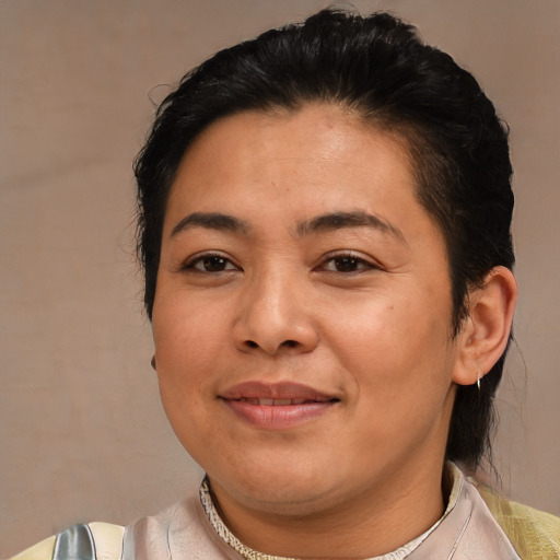 Joyful asian young-adult female with medium  brown hair and brown eyes