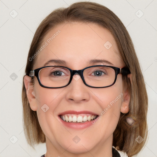 Joyful white adult female with medium  brown hair and blue eyes