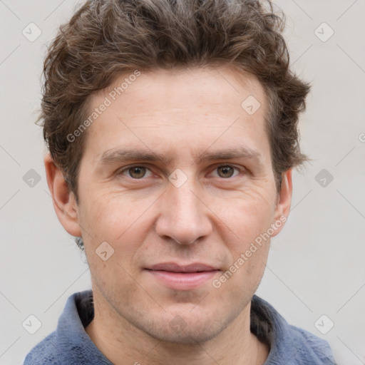 Joyful white adult male with short  brown hair and grey eyes