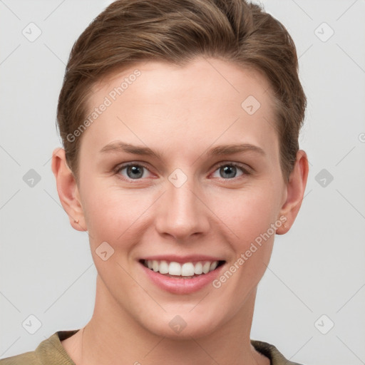 Joyful white young-adult female with short  brown hair and grey eyes