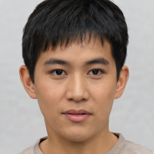 Neutral asian young-adult male with short  black hair and brown eyes