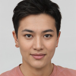 Joyful asian young-adult female with short  brown hair and brown eyes