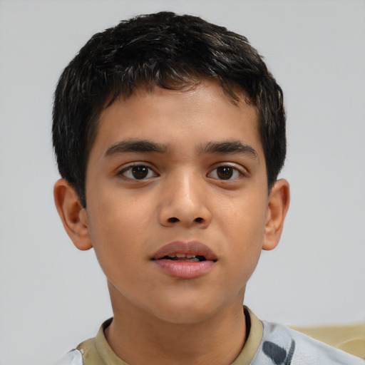 Joyful asian child male with short  brown hair and brown eyes
