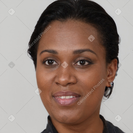 Joyful black adult female with short  brown hair and brown eyes