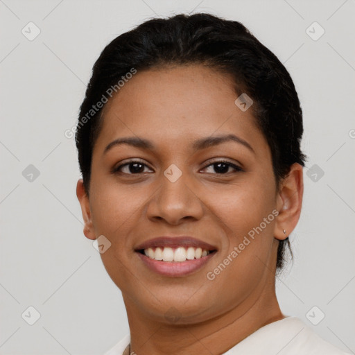 Joyful latino young-adult female with short  brown hair and brown eyes