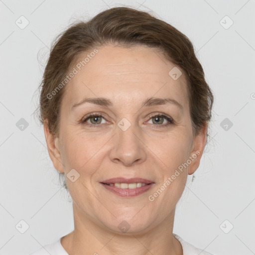 Joyful white adult female with short  brown hair and brown eyes