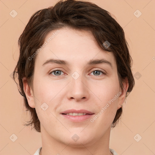 Joyful white young-adult female with medium  brown hair and grey eyes