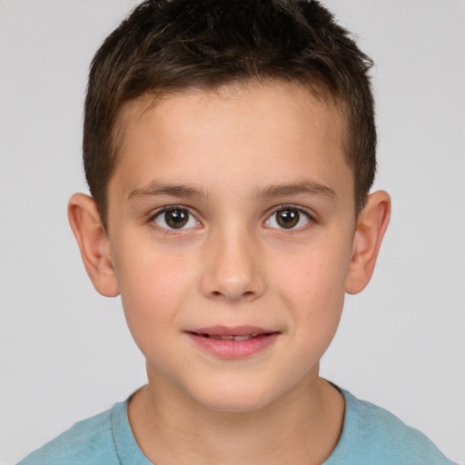 Joyful white child male with short  brown hair and brown eyes