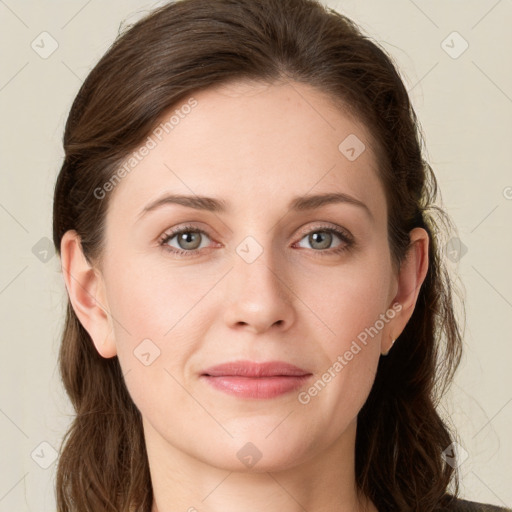 Joyful white young-adult female with long  brown hair and green eyes