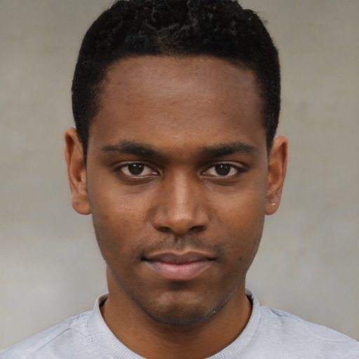 Neutral black young-adult male with short  black hair and brown eyes