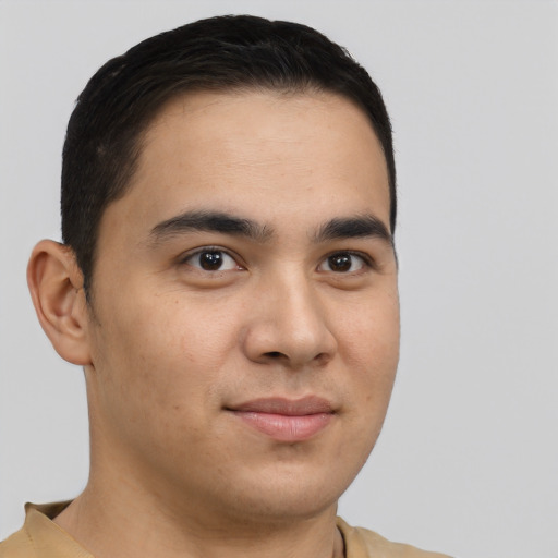 Joyful latino young-adult male with short  brown hair and brown eyes
