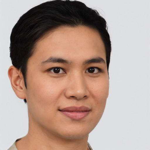 Joyful asian young-adult male with short  black hair and brown eyes