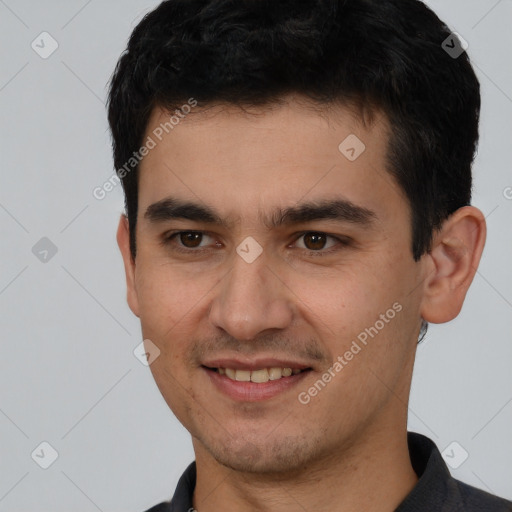 Joyful white young-adult male with short  black hair and brown eyes