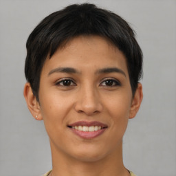 Joyful asian young-adult female with short  brown hair and brown eyes