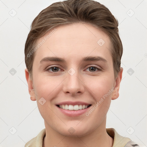 Joyful white young-adult female with short  brown hair and grey eyes