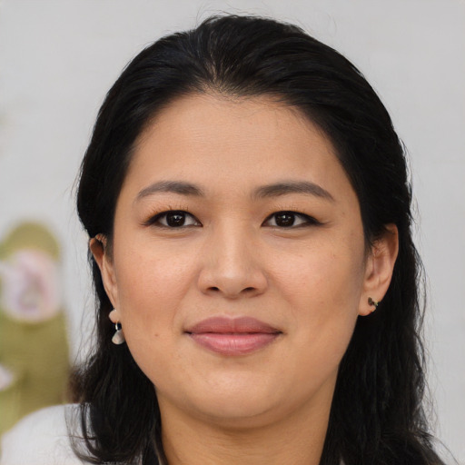 Joyful asian young-adult female with medium  black hair and brown eyes