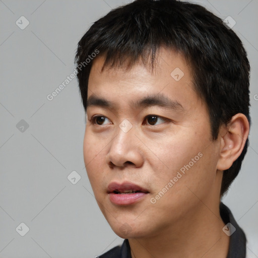 Neutral asian young-adult male with short  black hair and brown eyes