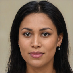 Joyful latino young-adult female with long  brown hair and brown eyes