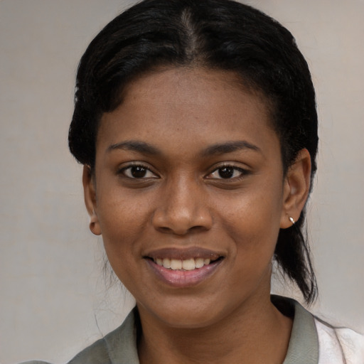 Joyful black young-adult female with medium  black hair and brown eyes