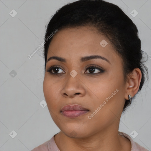 Joyful black young-adult female with medium  brown hair and brown eyes