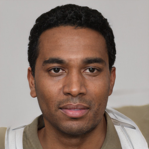 Neutral black young-adult male with short  black hair and brown eyes