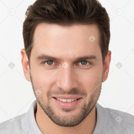 Joyful white young-adult male with short  brown hair and brown eyes