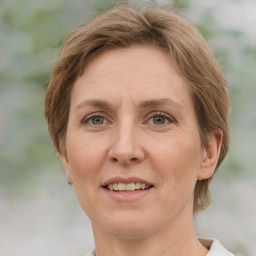 Joyful white adult female with short  brown hair and grey eyes