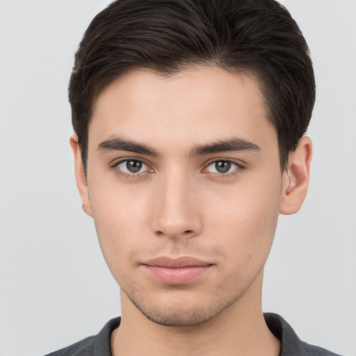 Neutral white young-adult male with short  brown hair and brown eyes