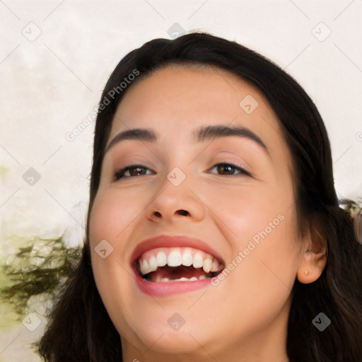 Joyful white young-adult female with long  black hair and brown eyes