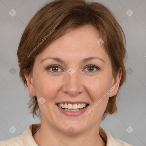 Joyful white adult female with medium  brown hair and grey eyes