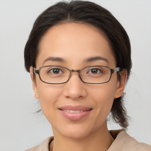 Joyful white young-adult female with medium  brown hair and brown eyes