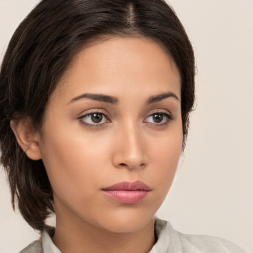 Neutral white young-adult female with medium  brown hair and brown eyes