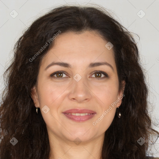 Joyful white adult female with long  brown hair and brown eyes