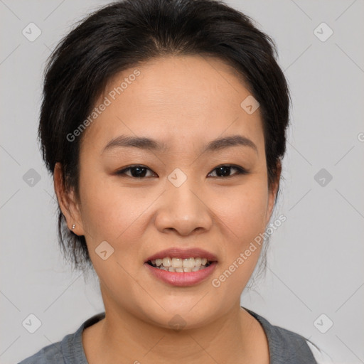 Joyful asian young-adult female with medium  black hair and brown eyes