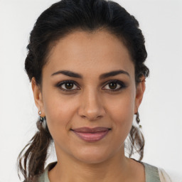 Joyful latino young-adult female with medium  brown hair and brown eyes