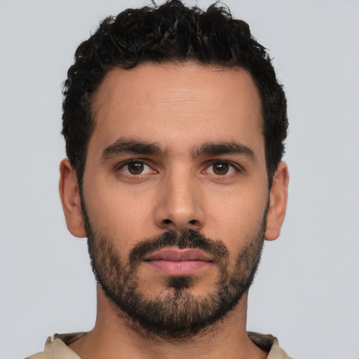 Neutral latino young-adult male with short  black hair and brown eyes