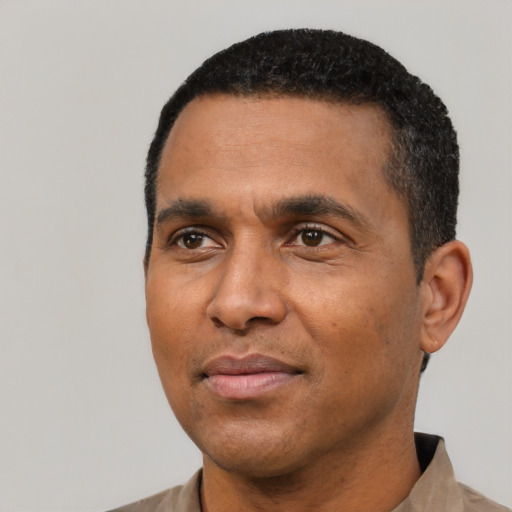 Neutral black young-adult male with short  black hair and brown eyes