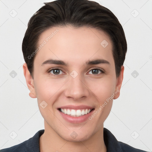 Joyful white young-adult female with short  brown hair and brown eyes