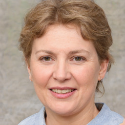 Joyful white adult female with medium  brown hair and grey eyes